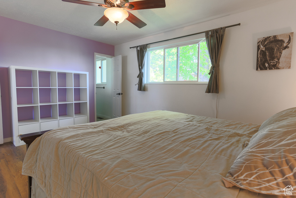 Bedroom with wood-type flooring and ceiling fan