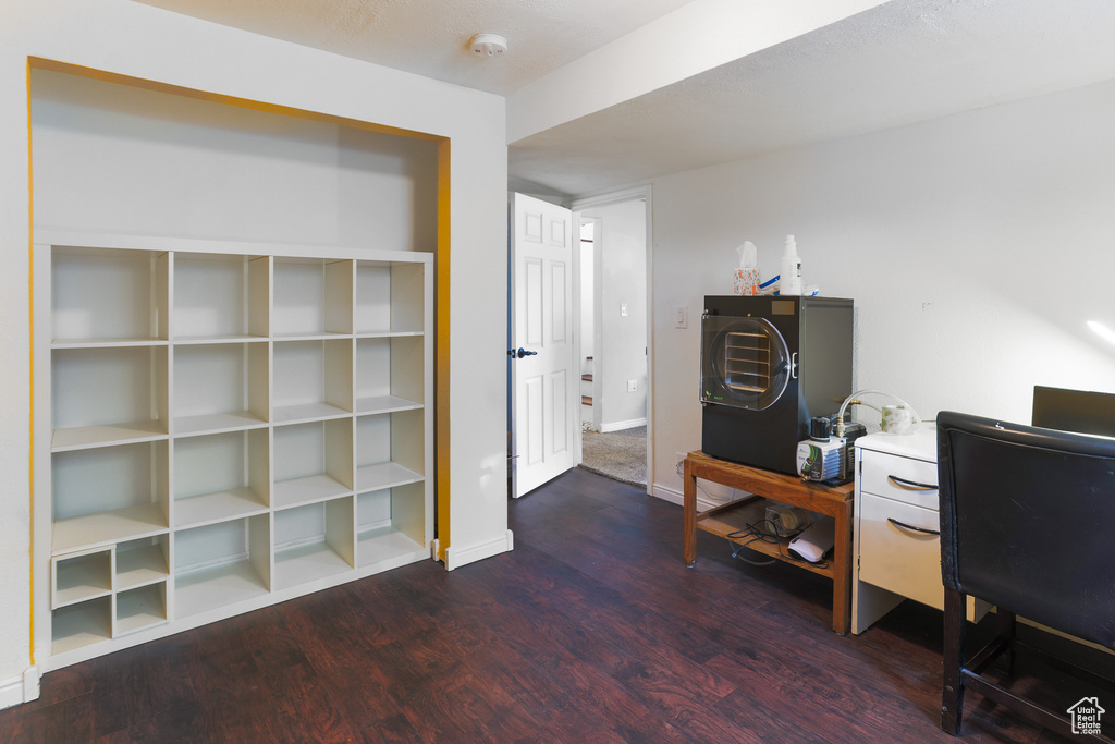Office with hardwood / wood-style flooring