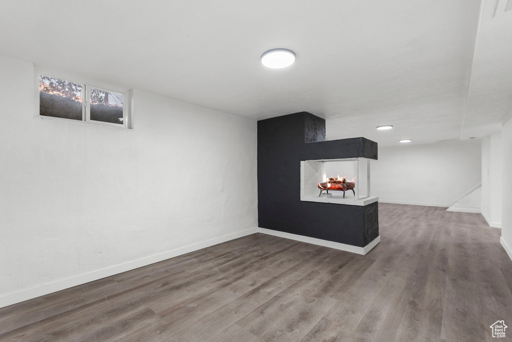 Basement featuring wood-type flooring