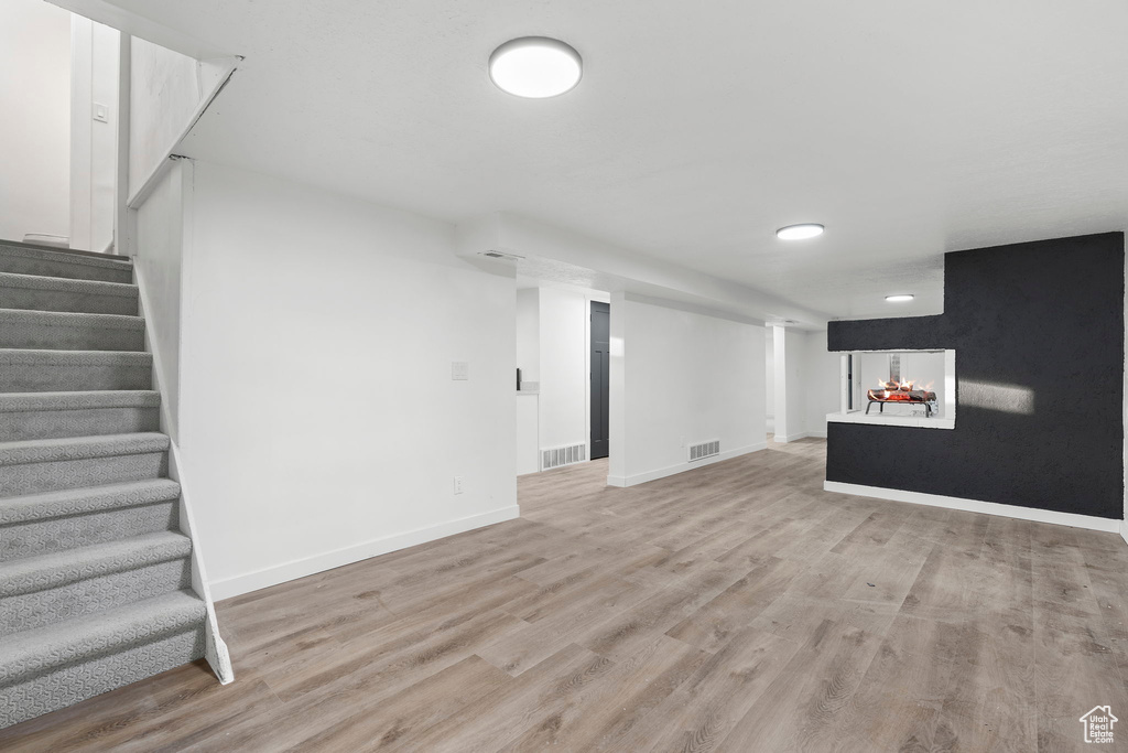 Basement featuring hardwood / wood-style flooring