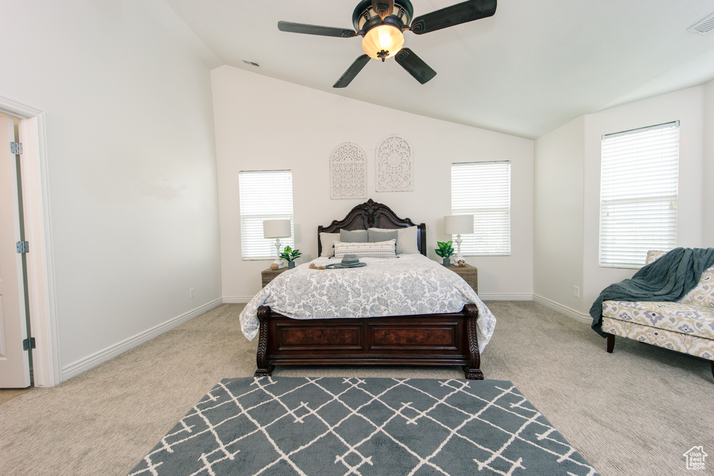 Bedroom with lofted ceiling, carpet floors, and ceiling fan