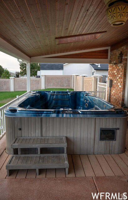 Wooden deck with a hot tub