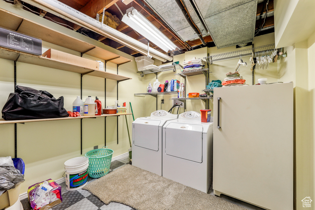 Laundry room featuring hookup for a washing machine and washing machine and clothes dryer