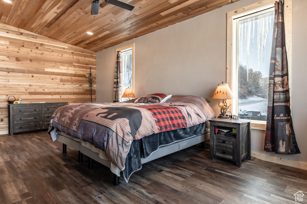 Bedroom with wood ceiling, dark hardwood / wood-style flooring, vaulted ceiling, and multiple windows