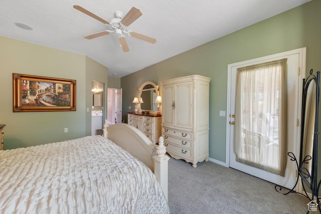 Bedroom featuring ensuite bath, ceiling fan, light carpet, and access to outside