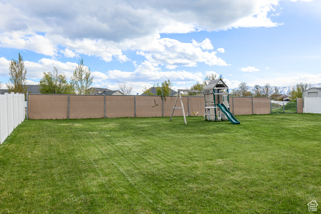 View of yard with a playground