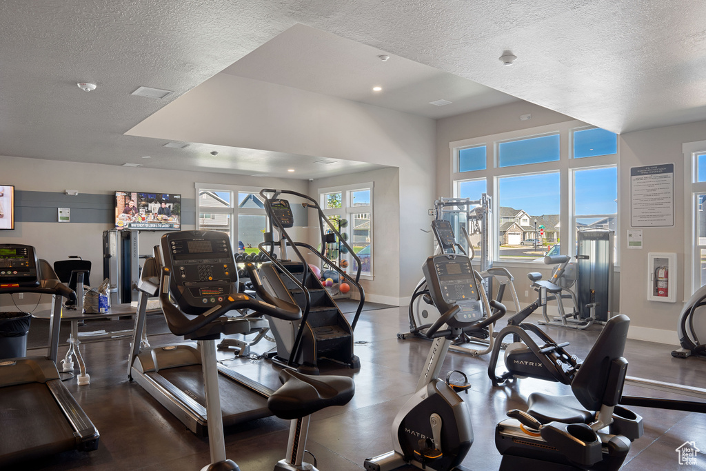 Exercise room with a textured ceiling