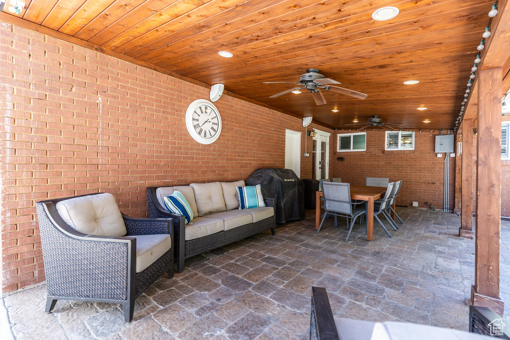 View of patio / terrace featuring area for grilling and ceiling fan