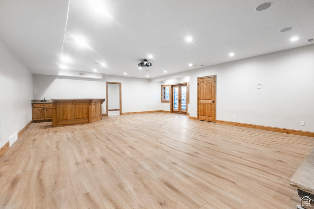 Interior space featuring sink and light wood-type flooring