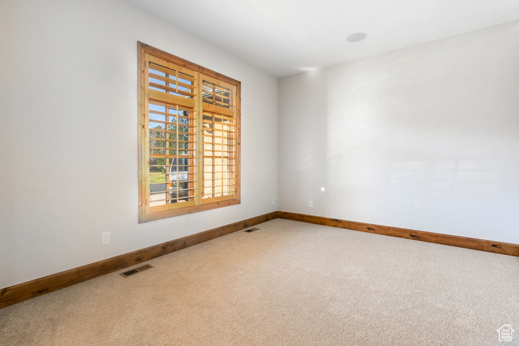 Spare room with carpet floors