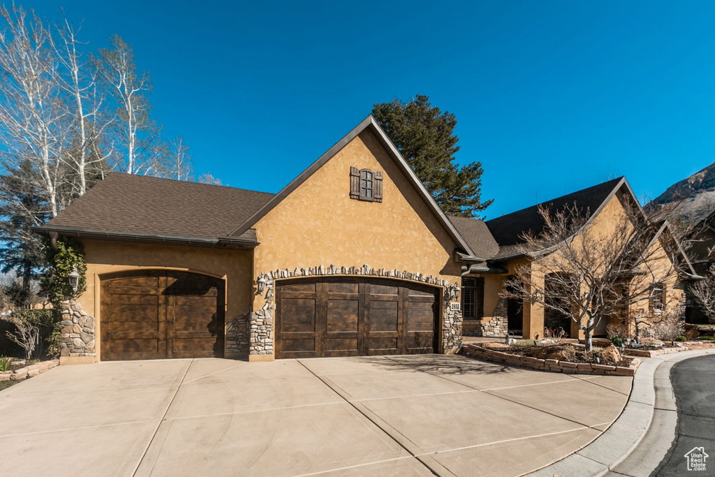 View of front of property with a garage