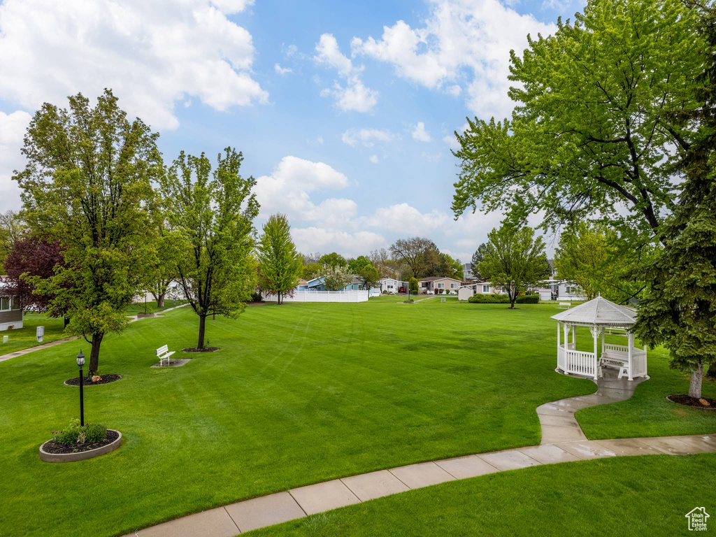 Surrounding community featuring a lawn and a gazebo
