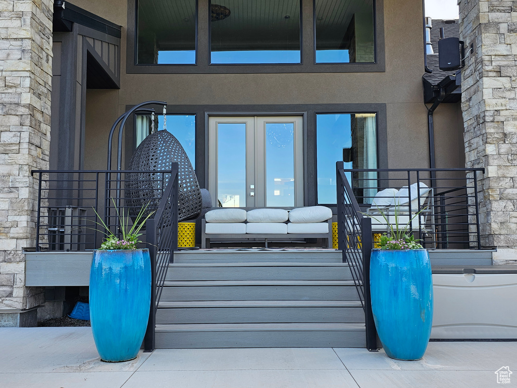 Property entrance featuring an outdoor living space