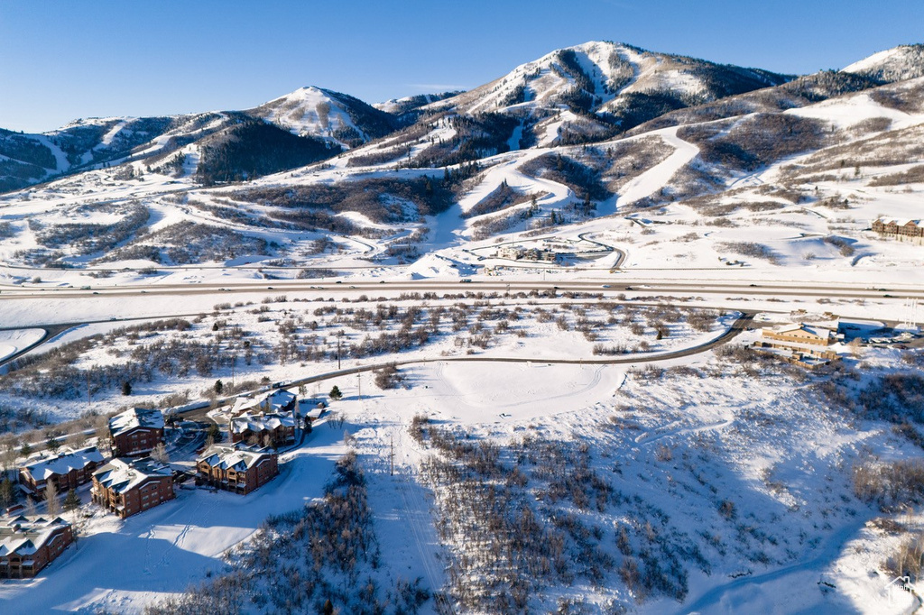 Snowy aerial view featuring a mountain view