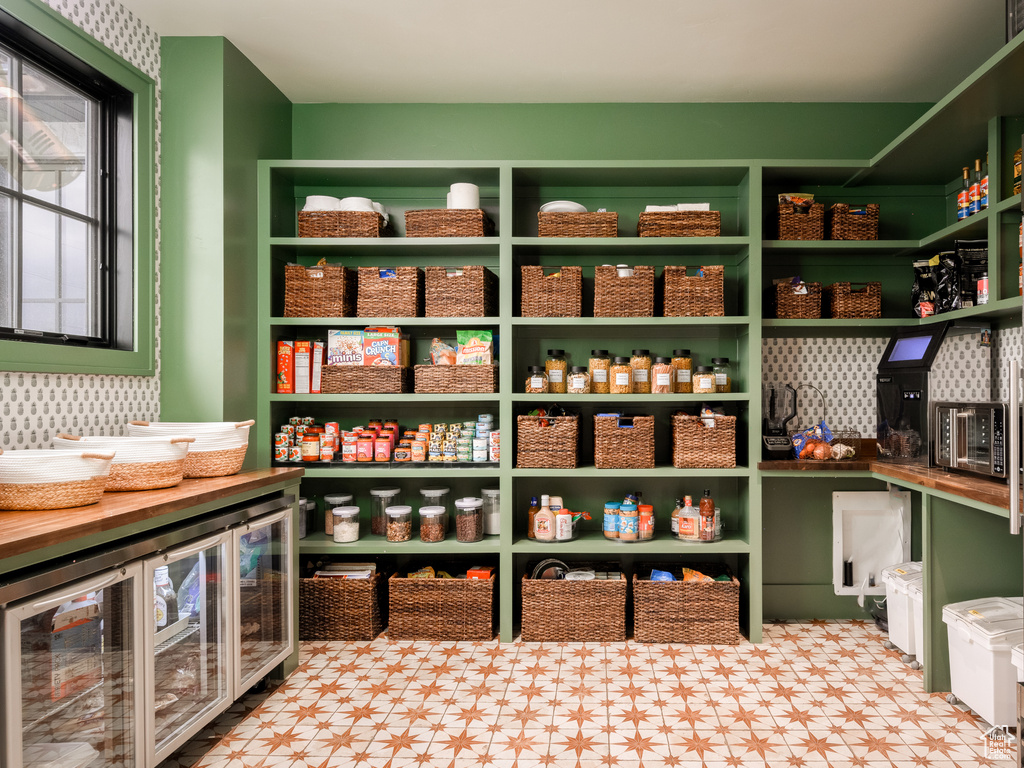 Pantry featuring wine cooler