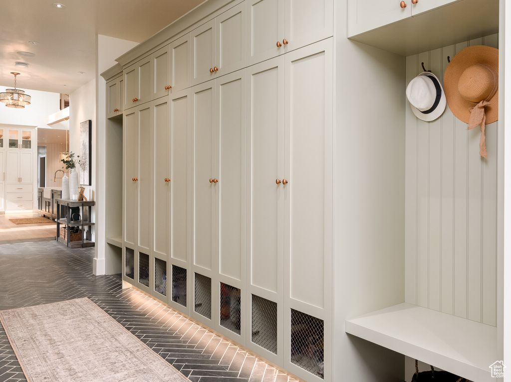 Mudroom with an inviting chandelier