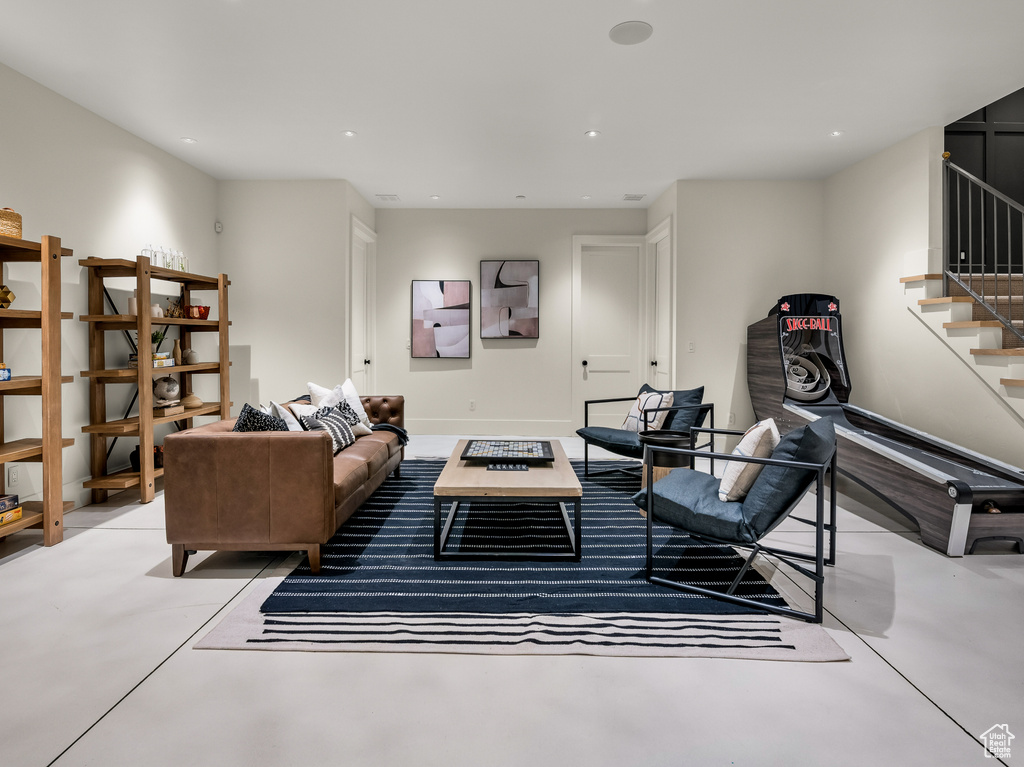 Living room featuring concrete flooring