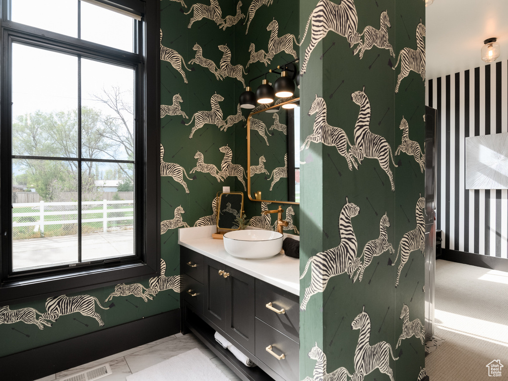 Bathroom with tile flooring and vanity