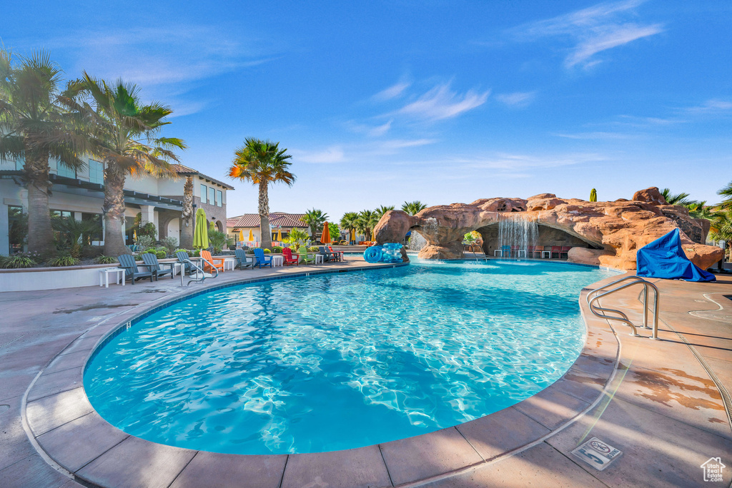 View of swimming pool featuring a patio area and pool water feature