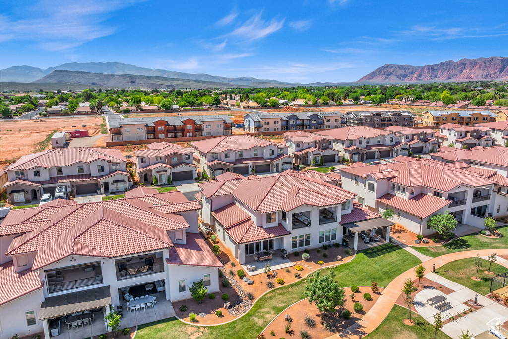 Birds eye view of property with a mountain view