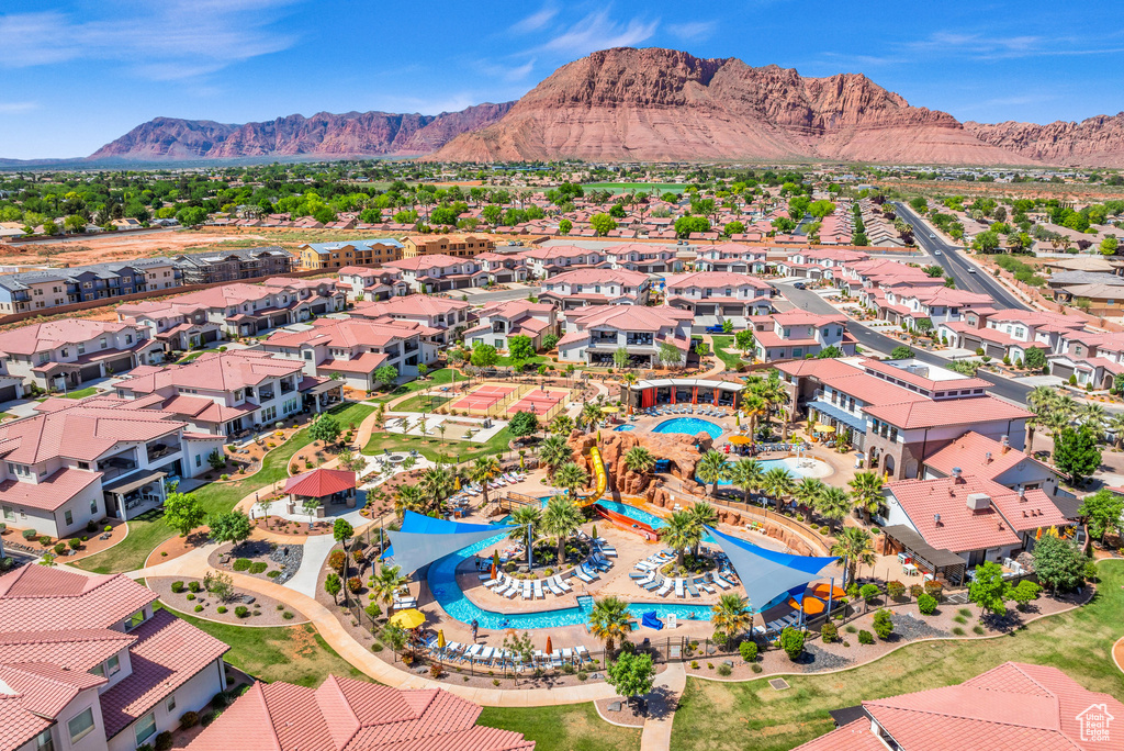 Birds eye view of property with a mountain view