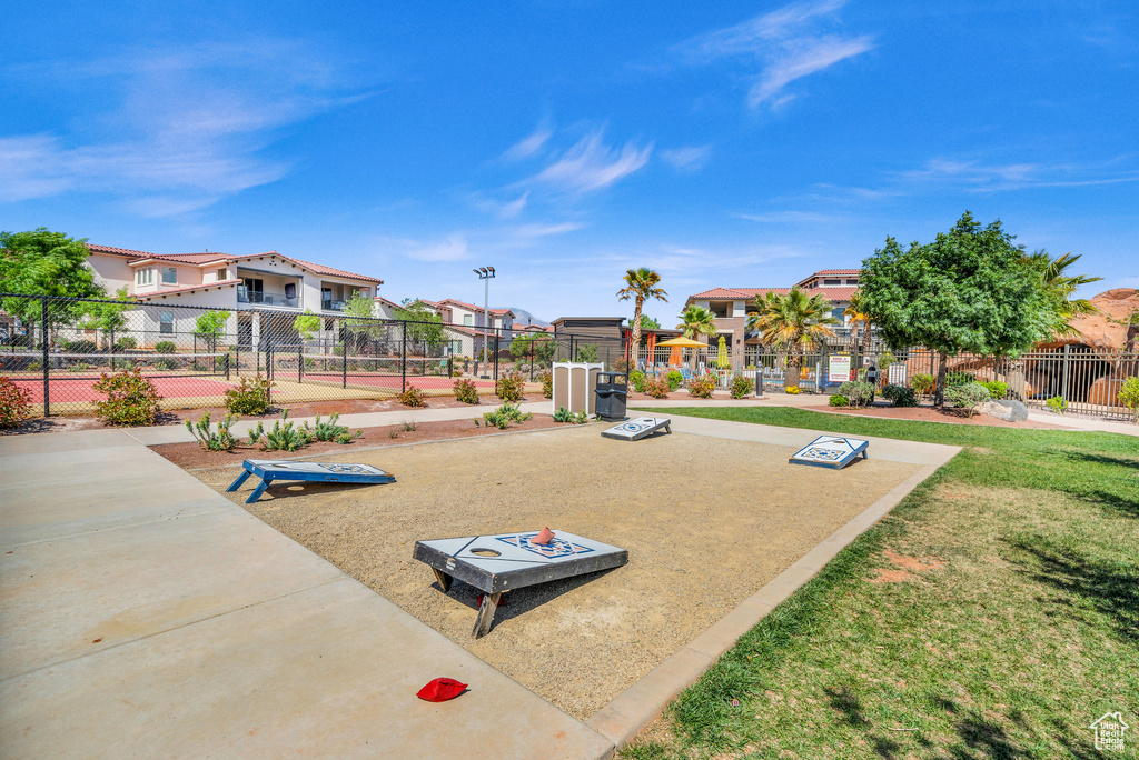 View of jungle gym with a lawn