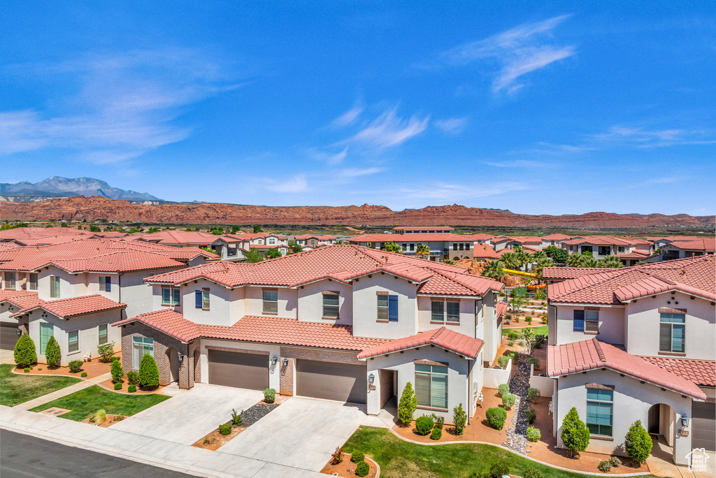 Exterior space featuring a mountain view and a garage