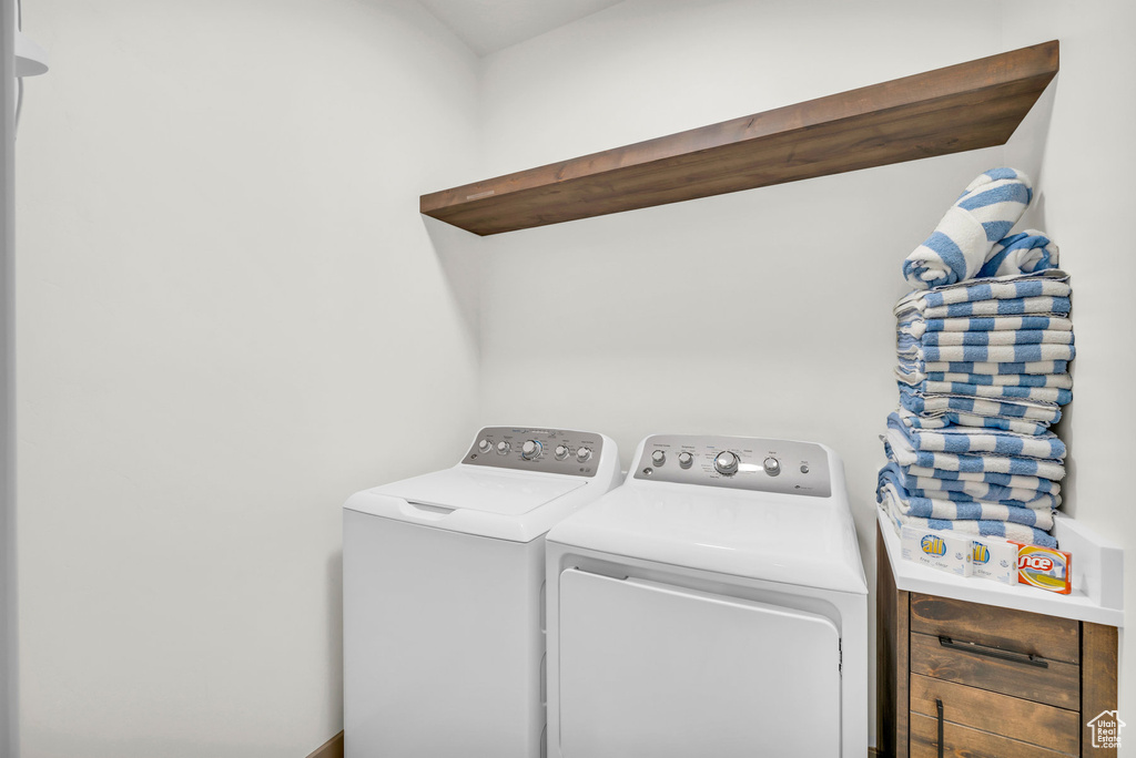 Washroom featuring independent washer and dryer