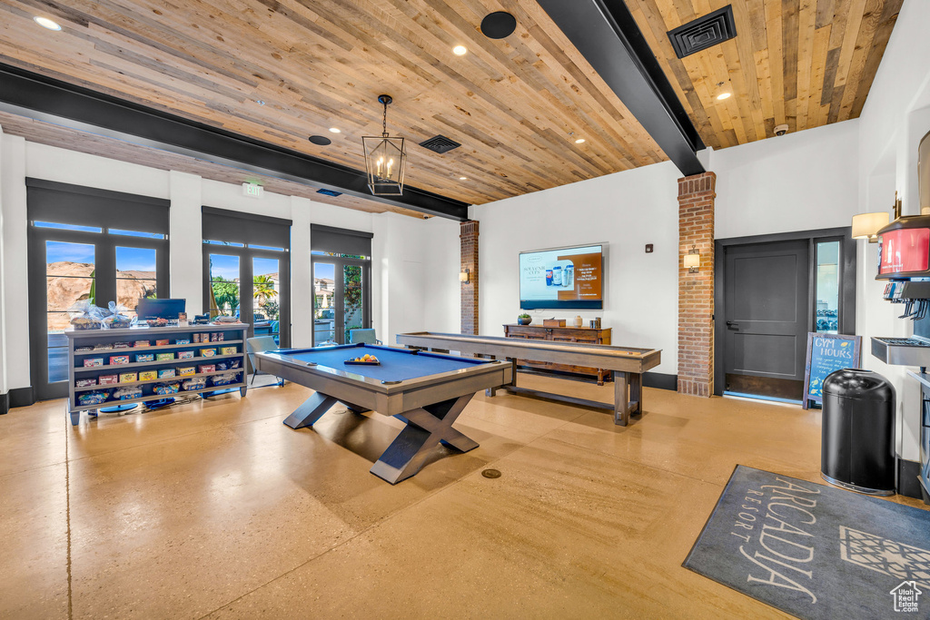 Playroom featuring brick wall, pool table, and wooden ceiling