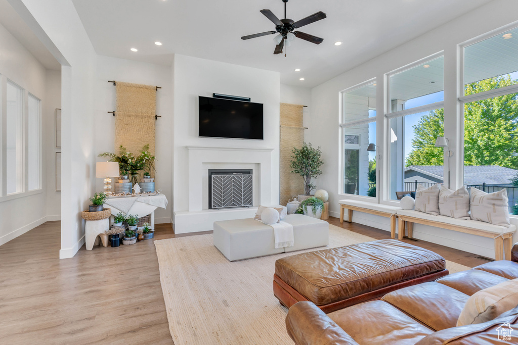 Living room featuring plenty of natural light, ceiling fan, and hardwood / wood-style floors