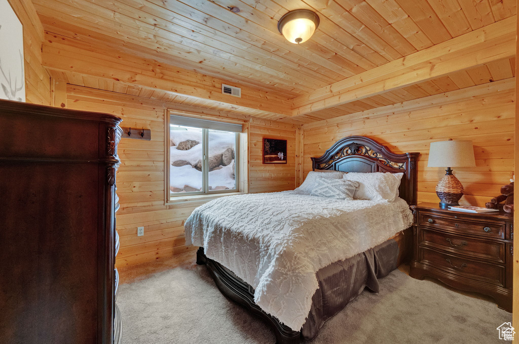 Carpeted bedroom with wooden ceiling