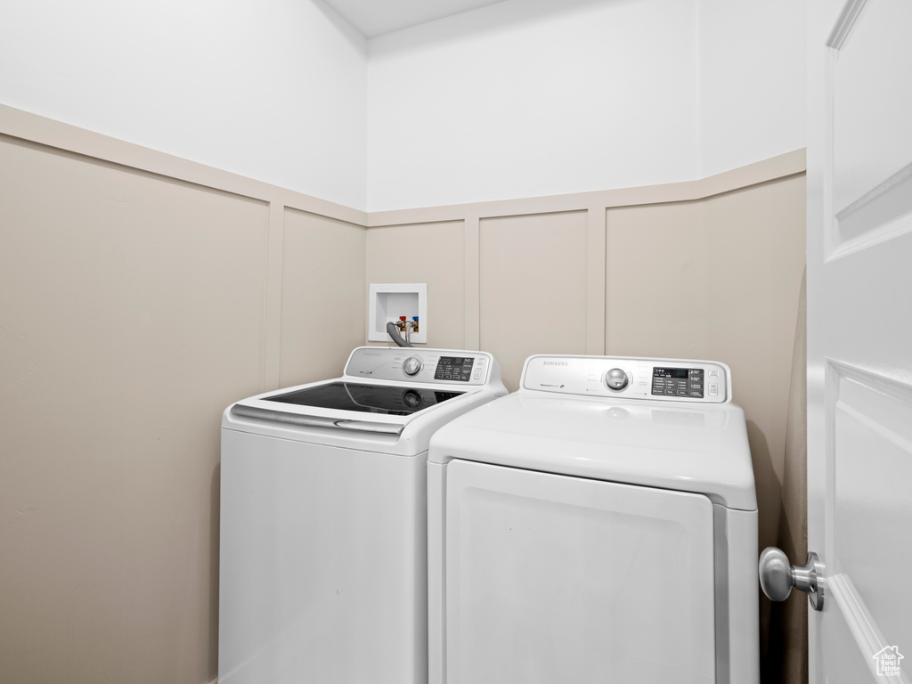 Laundry room with washer and dryer and hookup for a washing machine