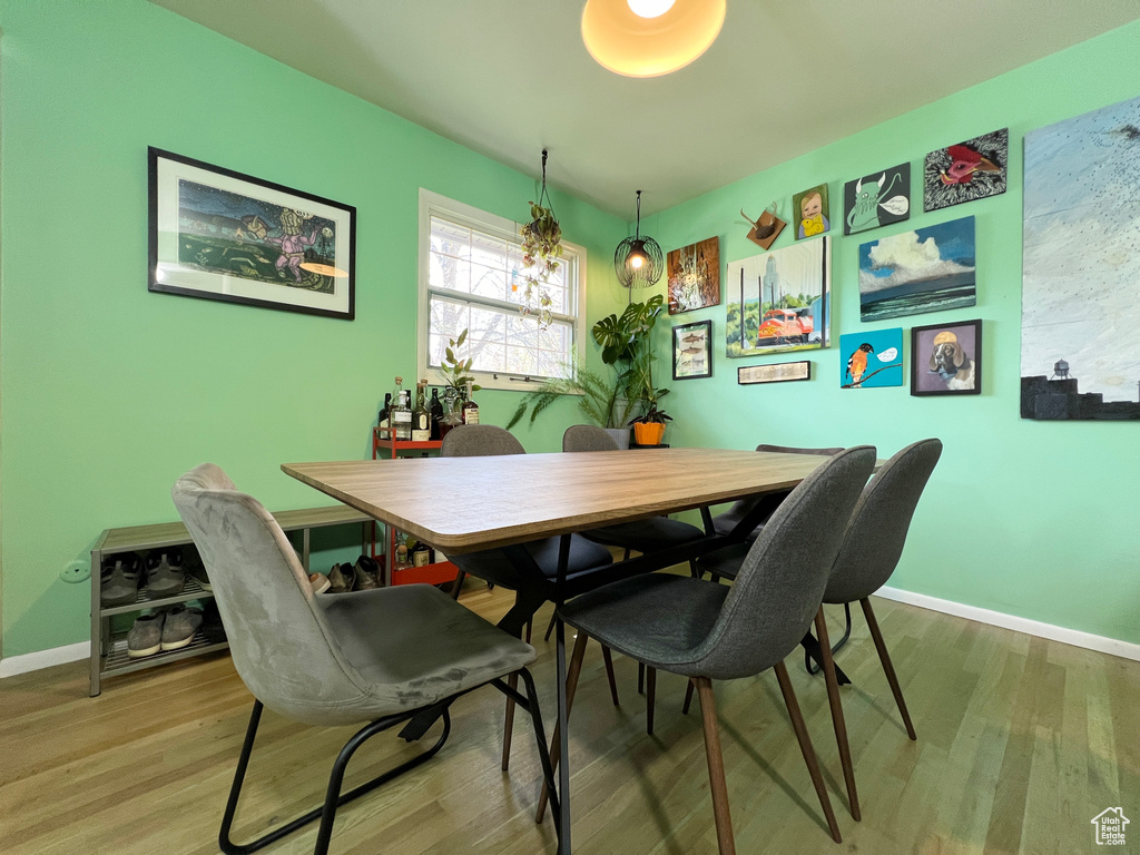 Dining area with wood-type flooring