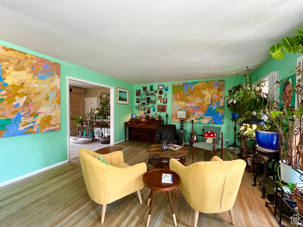 Living room with wood-type flooring