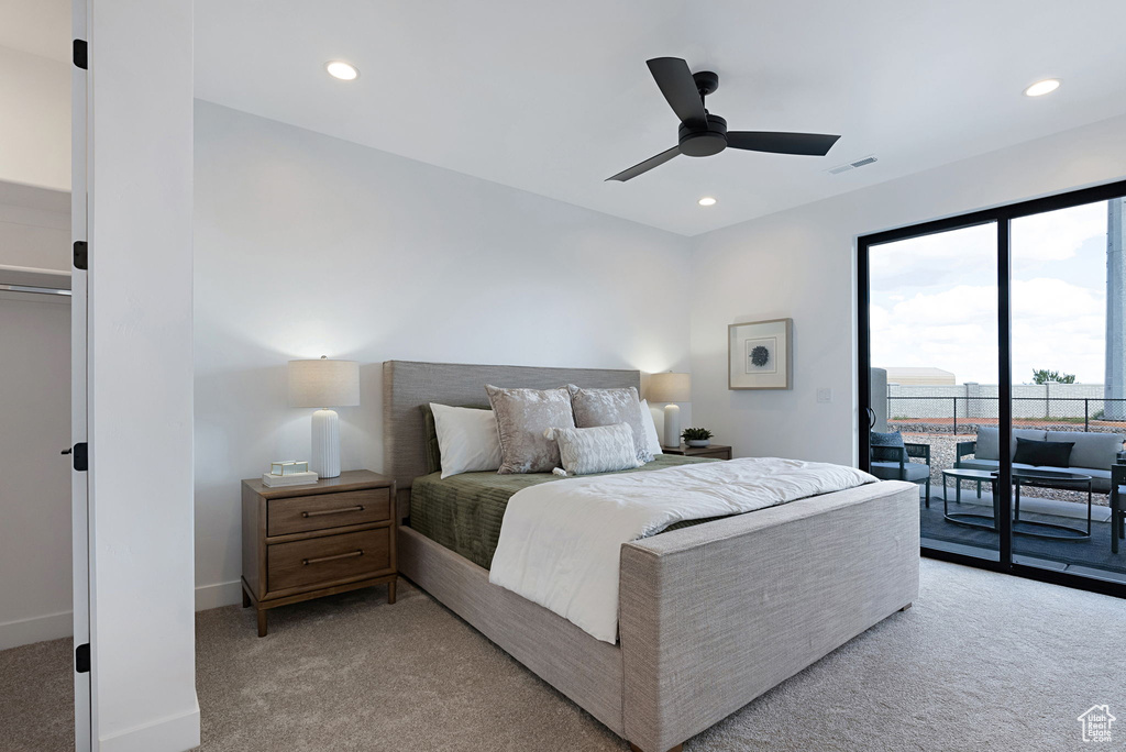 Bedroom featuring access to exterior, ceiling fan, and light colored carpet