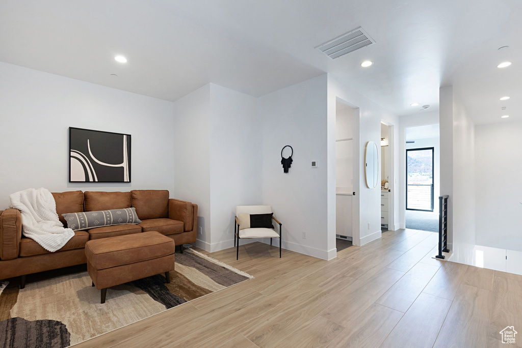 Living room with light hardwood / wood-style floors