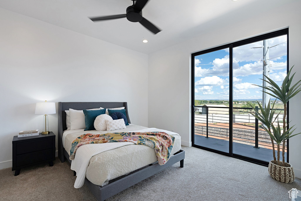 Bedroom with access to exterior, ceiling fan, and carpet