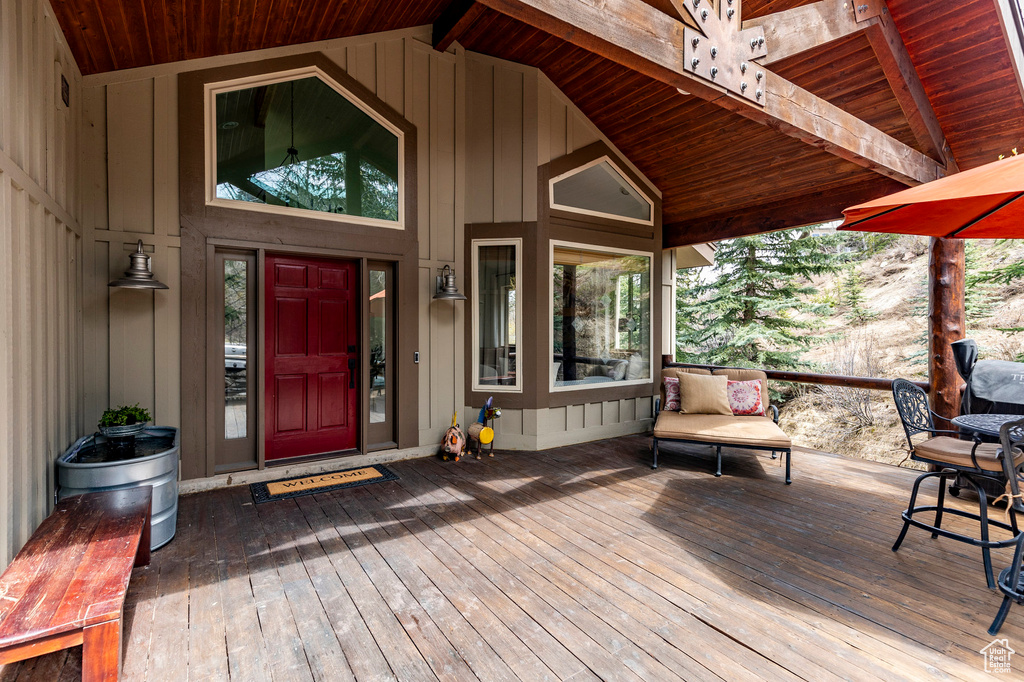 Doorway to property with a wooden deck