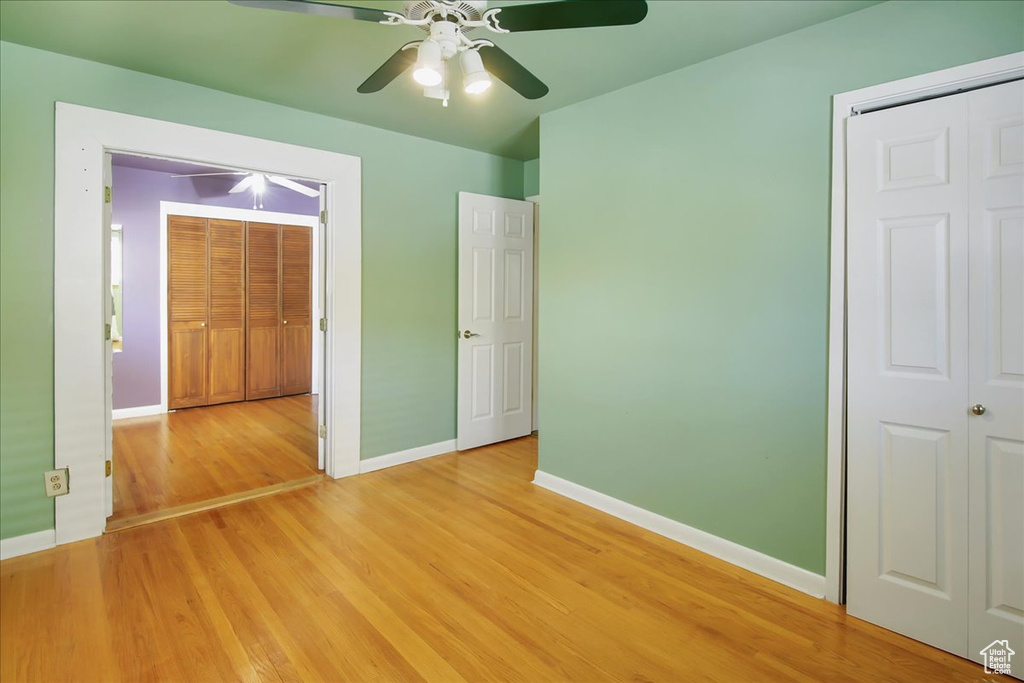 Interior space featuring ceiling fan and light wood-type flooring
