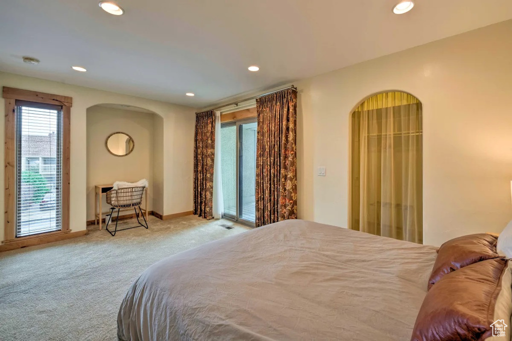 Bedroom featuring carpet and access to exterior