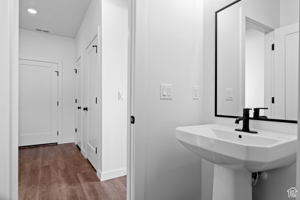 Bathroom featuring wood-type flooring