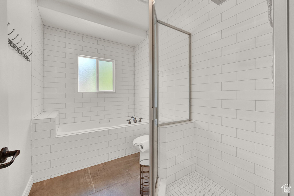 Bathroom featuring tile flooring and independent shower and bath