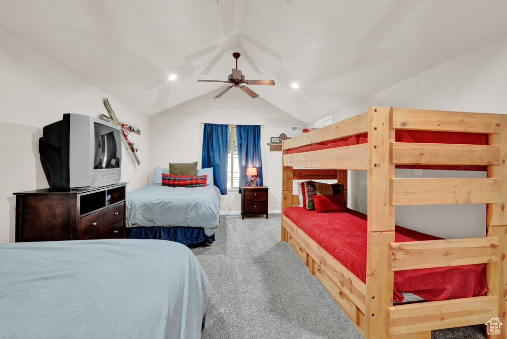 Bedroom featuring lofted ceiling, carpet floors, and ceiling fan