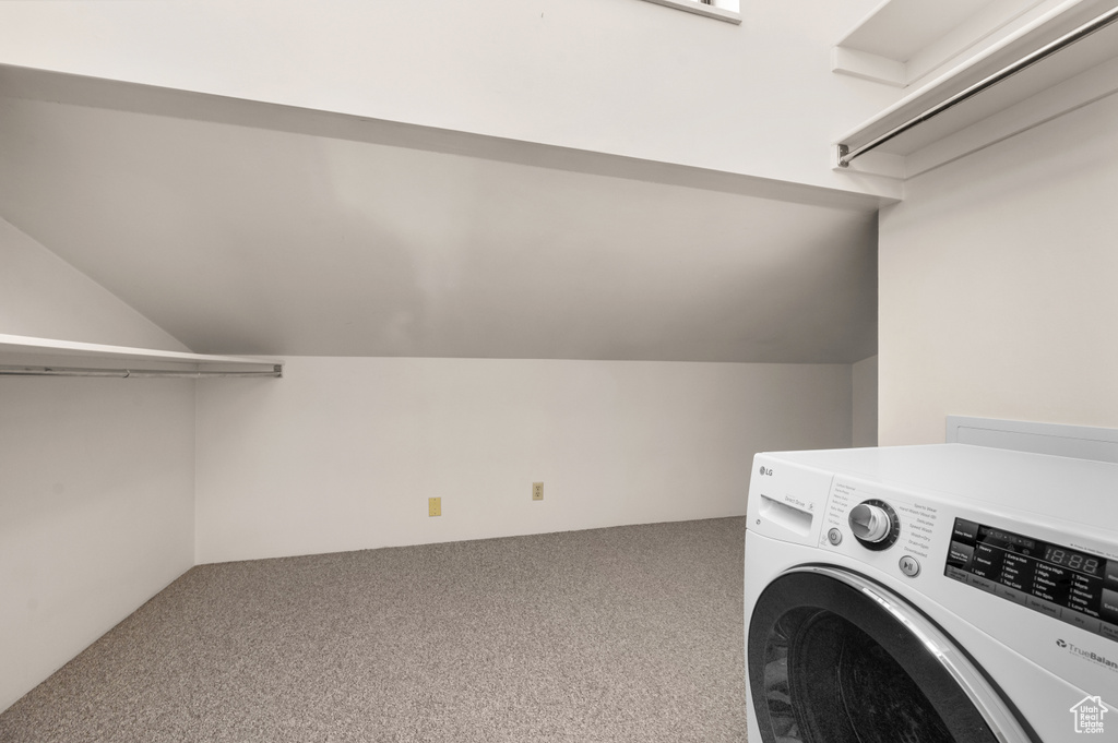 Laundry area featuring carpet and washer / clothes dryer