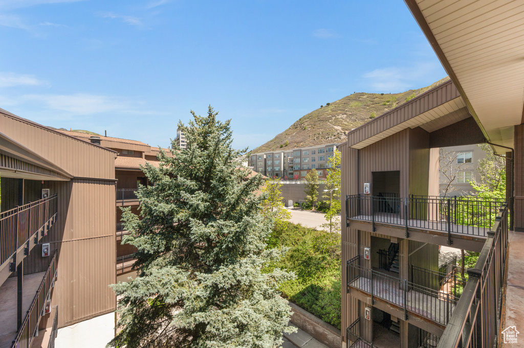 Exterior space featuring a mountain view and a balcony