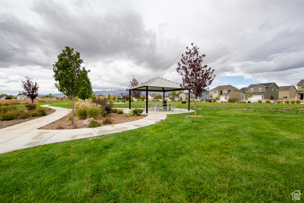 View of home\'s community featuring a gazebo and a lawn