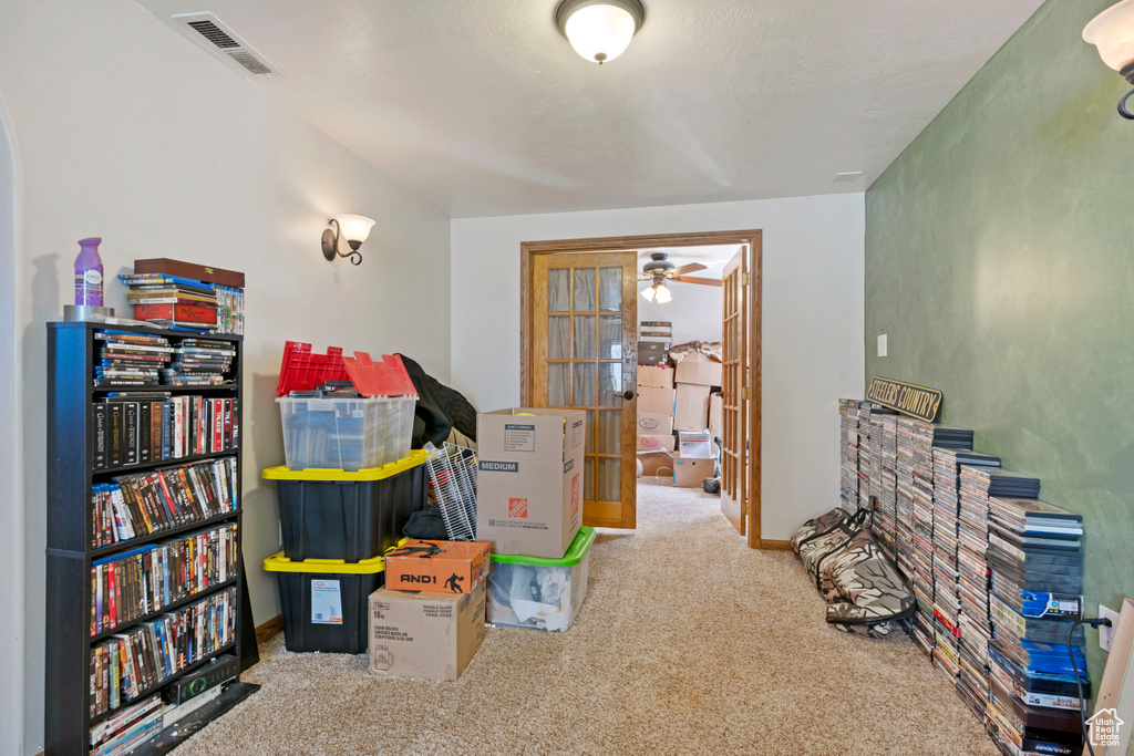 Playroom with carpet flooring and ceiling fan