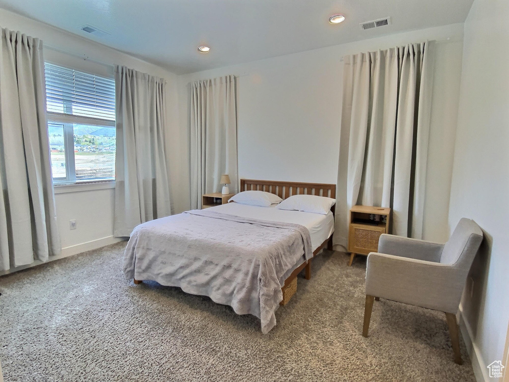 Bedroom with carpet flooring