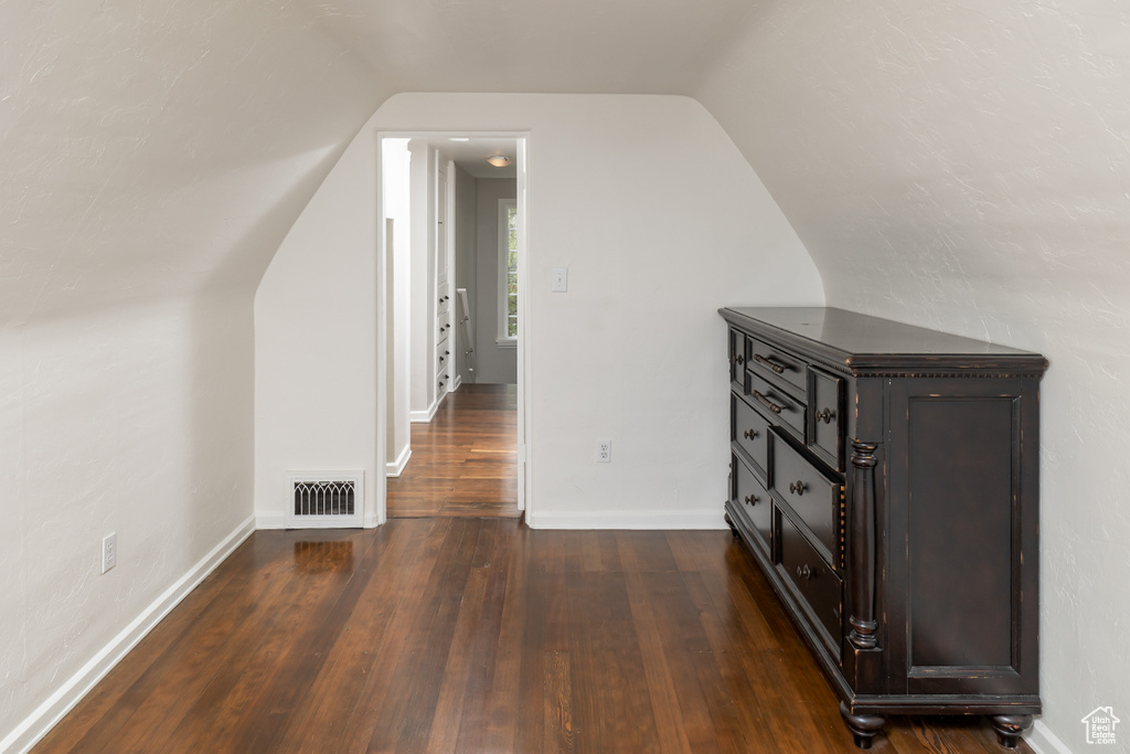 Bonus room featuring vaulted ceiling and hardwood / wood-style flooring
