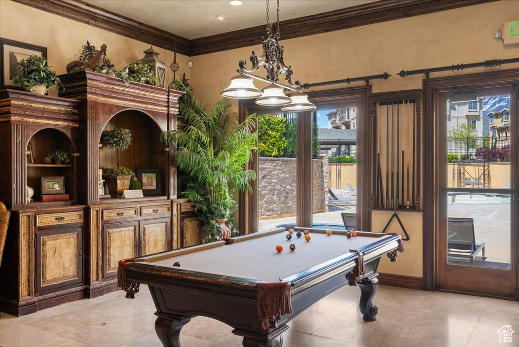 Recreation room featuring a wealth of natural light, billiards, crown molding, and light tile flooring